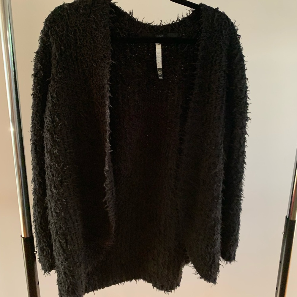 Fuzzy oversized open cardigan sweater.